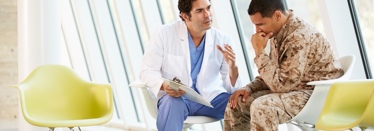 doctor talking to military personnel